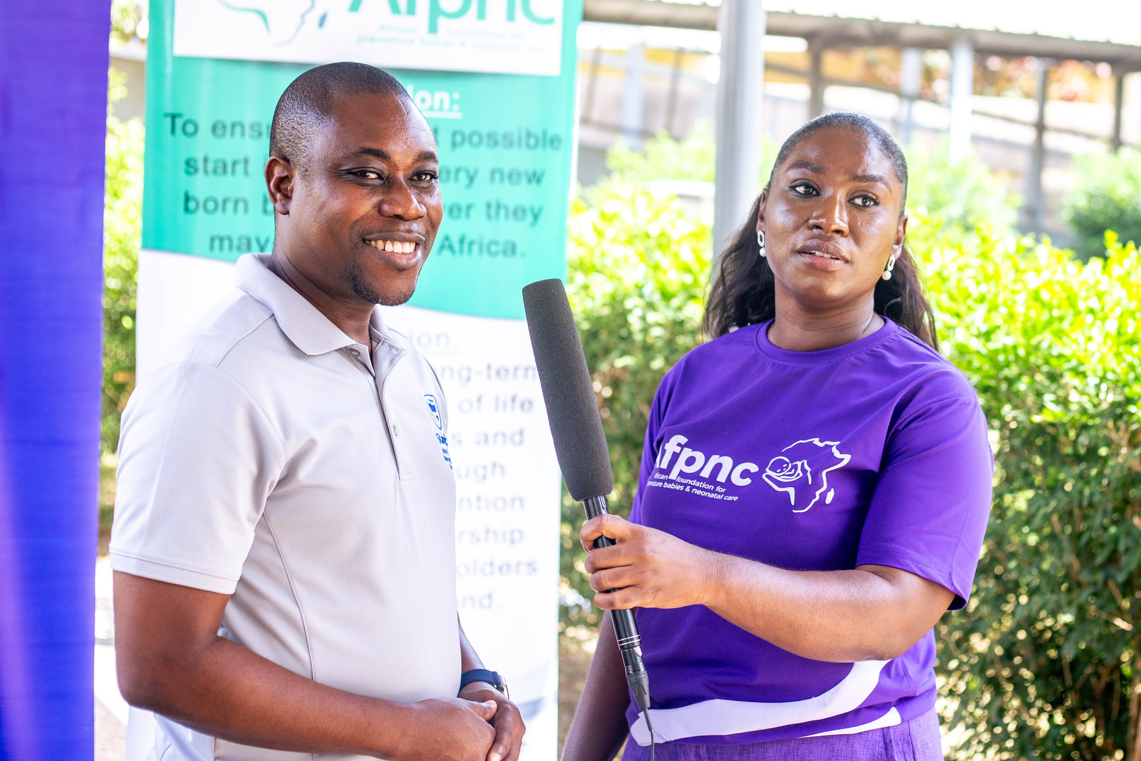 Volunteers handing over Purple Baskets