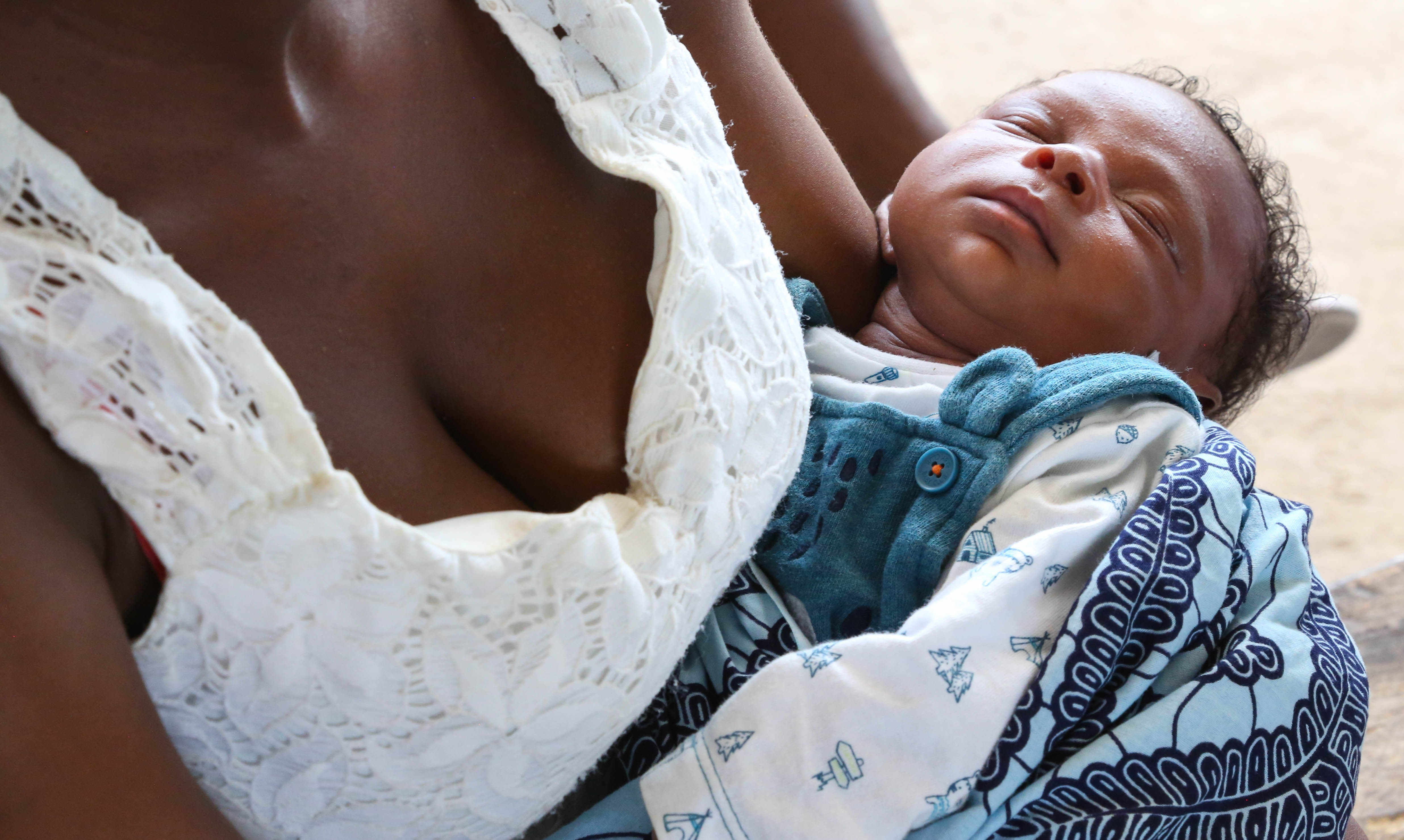 A baby cared for by its family